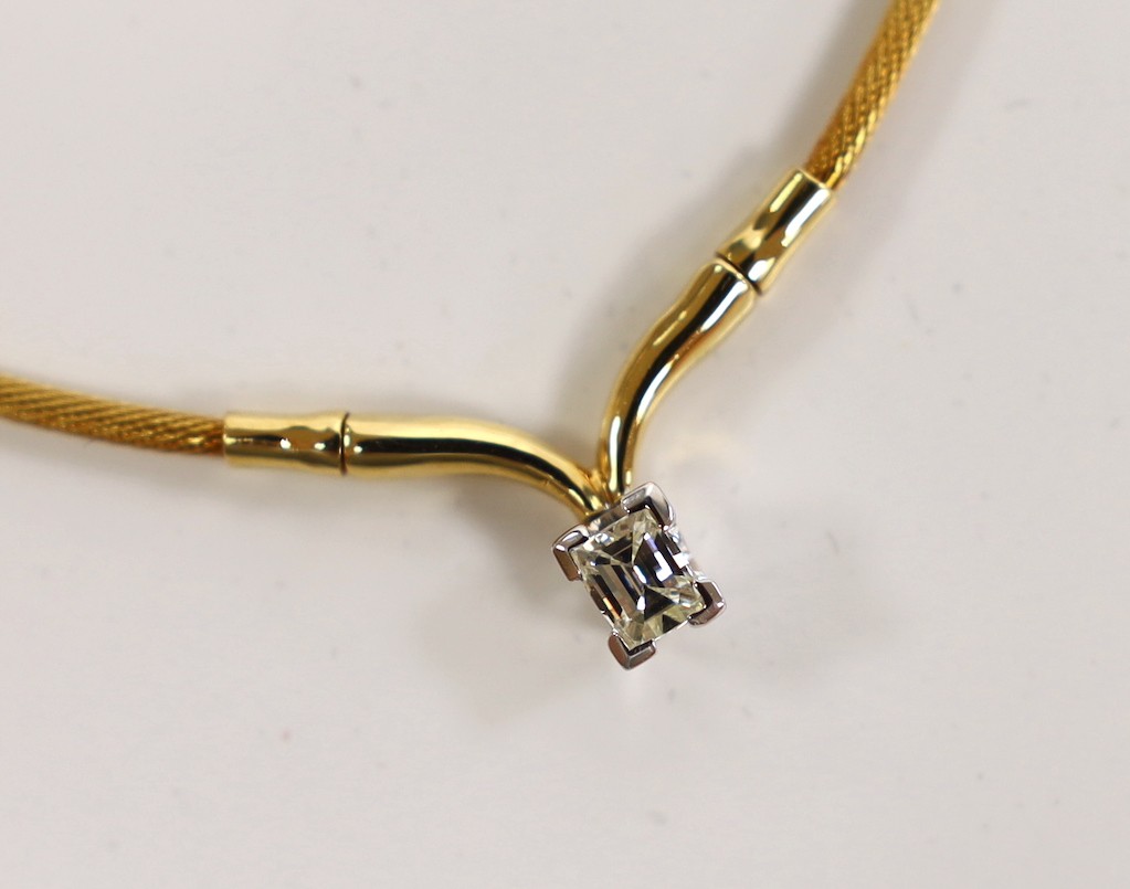 A modern 750 yellow metal and fancy cut solitaire diamond set pendant necklace, approx. 36cm, gross weight 9.3 grams.